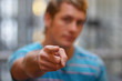 personal trainer pointing at you.