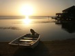sunset with boat on roatan island