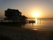 house with sunset on roatan island