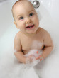 smile baby in bath with two teeths