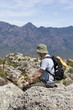 old man sitting on mountain top 2