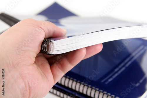 Photo: hand over a generic manual hand over a generic manual