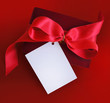 present with red ribbon and card.