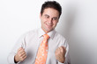 young smiling business man showing fists