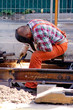 construction worker fixing rails