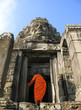 a monk enters bayon temple at angkor thom, cambodi