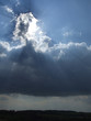 sun and hope above dark clouds