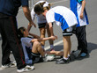 compassion - team players giving first aid compassion - team players giving first aid