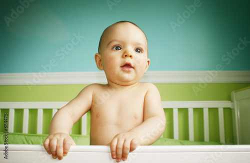 Photo: baby boy playing in crib baby boy playing in crib