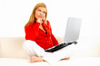 women with laptop on couch