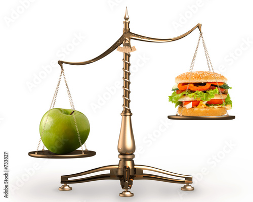 Photo: apple and hamburger on scales conceptual apple and hamburger on scales conceptual