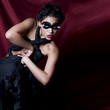 the lady in the black gem mask
