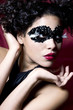 attractive young woman wearing a black gem mask attractive young woman wearing a black gem mask