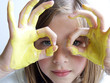 girl with yellow hands