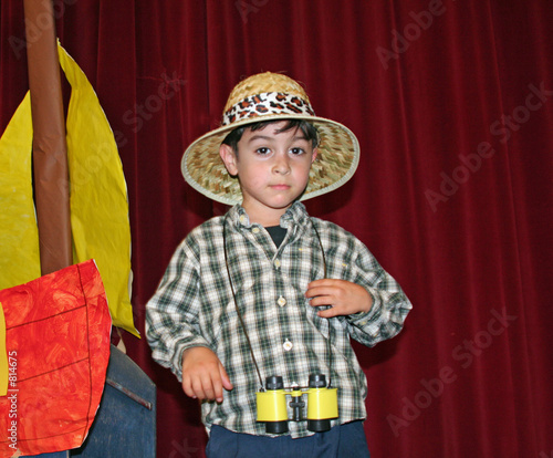 boy with straw hat and binos