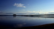 long jetty in dusk and calm waters long jetty in dusk and calm waters