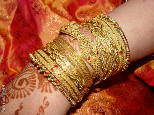 gold jewellery on a bride