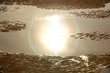 reflet du soleil dans une mare