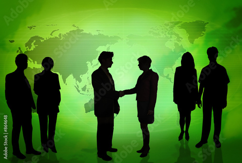 business people in front of a world map green