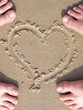 Image : sand heart with lovers foot