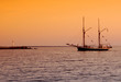 ship heading to docks after sunset