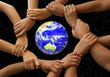 hands framing the earth
