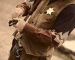 old west - sherrif loads his gun