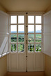 view through wooden doors to countryside