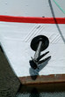 black anchor on a white boat