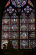 statue before a cathedral window