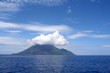 clouds over volcanic island