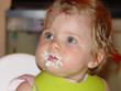 baby girl after birthday cake
