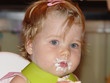 baby eating cake