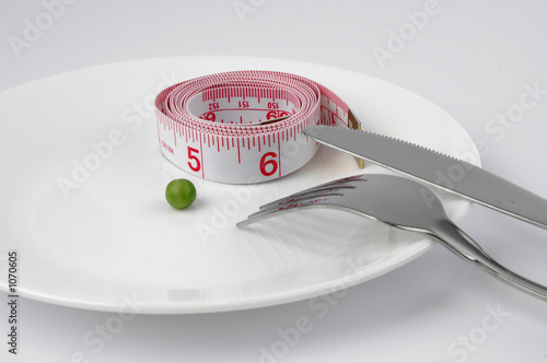 Photo: pea and measuring tape on a plate pea and measuring tape on a plate