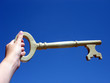 hand holding a key hand holding a key