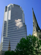 old church overshadowed by a modern skyscraper old church overshadowed by a modern skyscraper