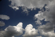 blue sky with cumulus storm clouds
