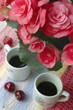 pink begonia with coffee cups at blured background pink begonia with coffee cups at blured background
