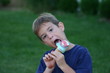 boy licking ice cream cone
