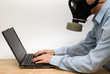 man in gas mask working on his laptop man in gas mask working on his laptop