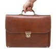 hand holding isolated brown leather briefcase hand holding isolated brown leather briefcase