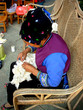 minority chinese woman sewing