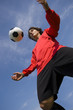 Photo: soccer football player in red controlling ball soccer football player in red controlling ball