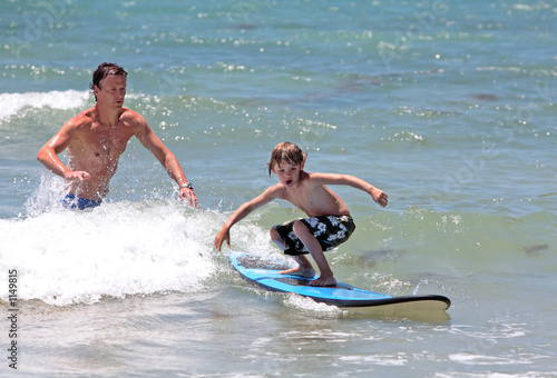 Photo: father teaching his young son how to surf father teaching his young son how to surf