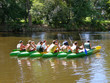 seven canoes with young people in the river seven canoes with young people in the river