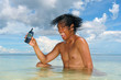 advertising a cell-phone in a tropical sea by an a
