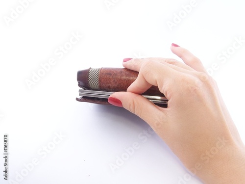 Photo: woman's hand holding wallet woman's hand holding wallet