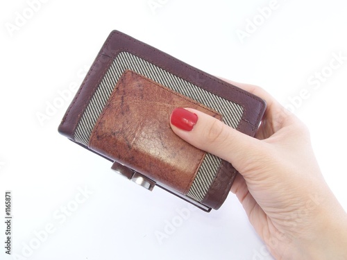 Photo: woman's hand holding wallet woman's hand holding wallet