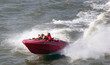 men in speed boat on water