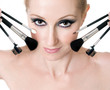 female face with cosmetic makeup brushes